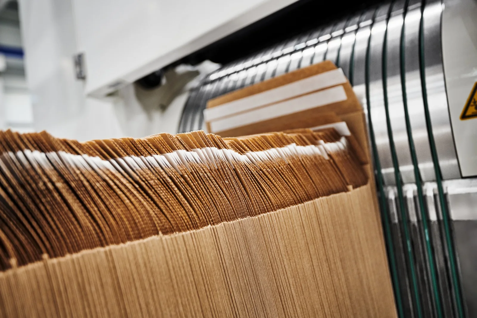 Stacked paper e-commerce mailer bags produced on Garant e.BAG machines