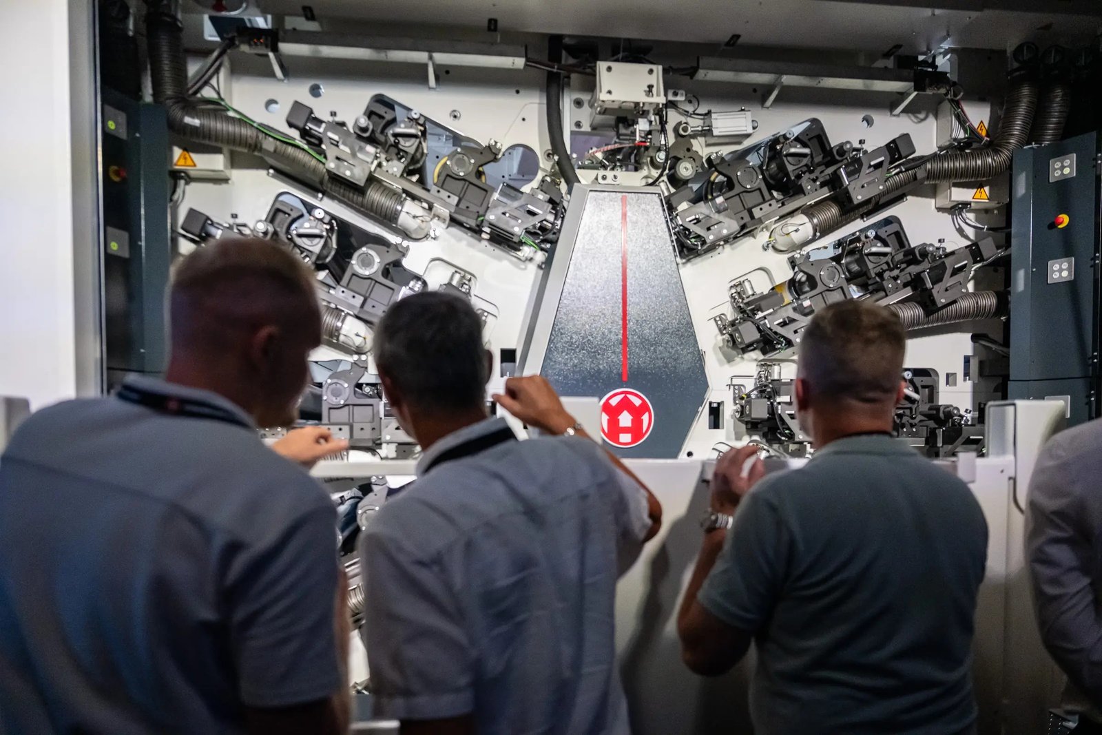 Visitors looking into an open W&H ONEFLEX print unit