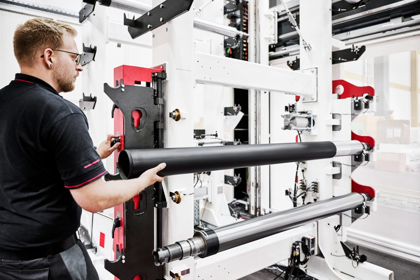 Technician loading a print cylinder on the W&H VISTAFLEX II